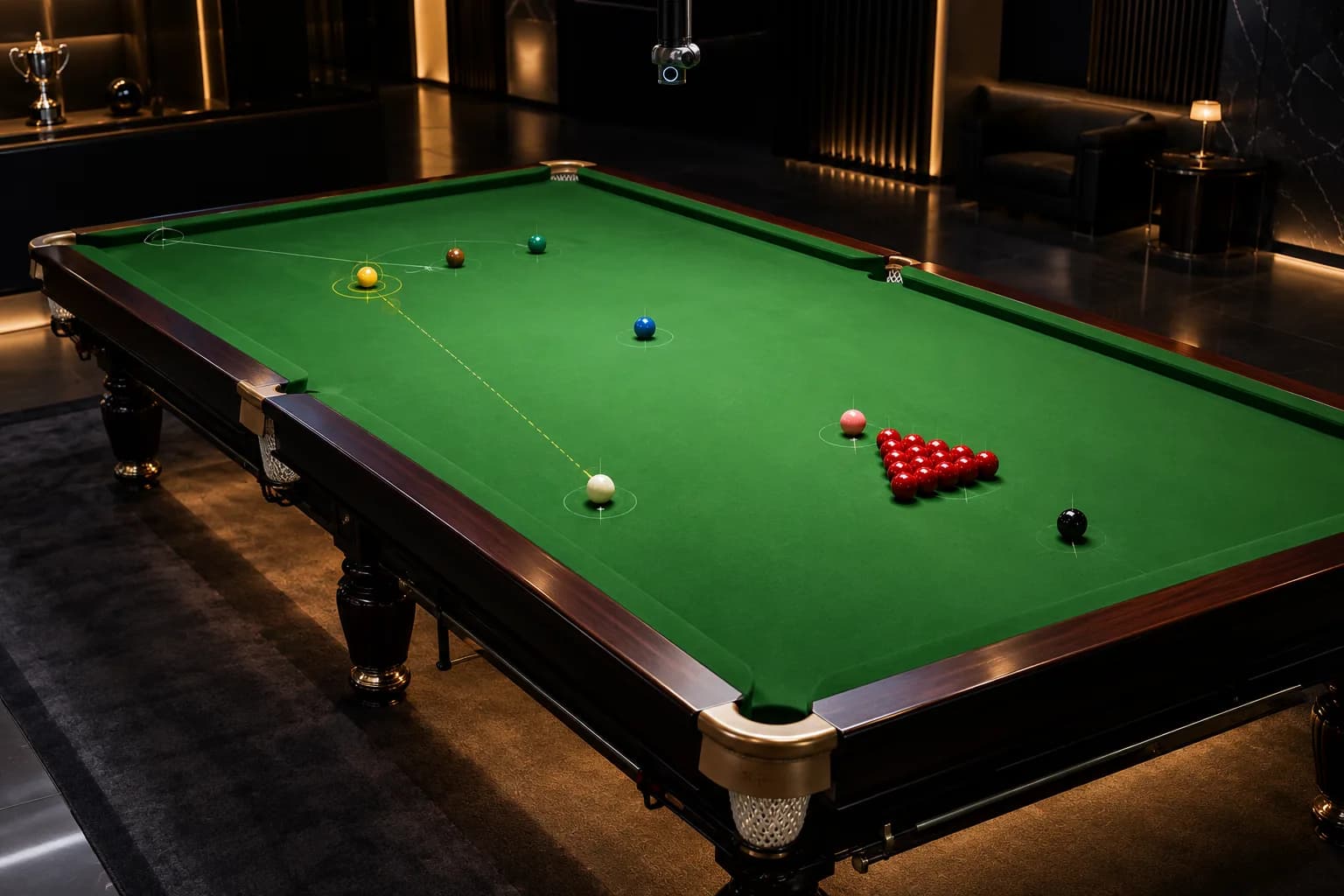 Elevated view of a snooker table with coloured balls and a small chrome camera above it